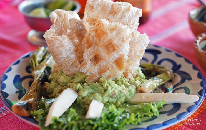 Guacamole with chicharons and cheese