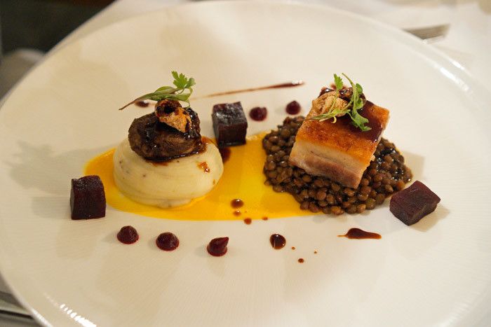 Pork belly and braised pork cheek, with carrot and cardamom puree, spiced lentils and a five-spice jus.