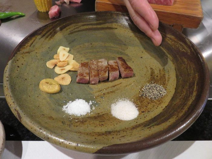 The beef was served with salt, pepper and fried garlic slices