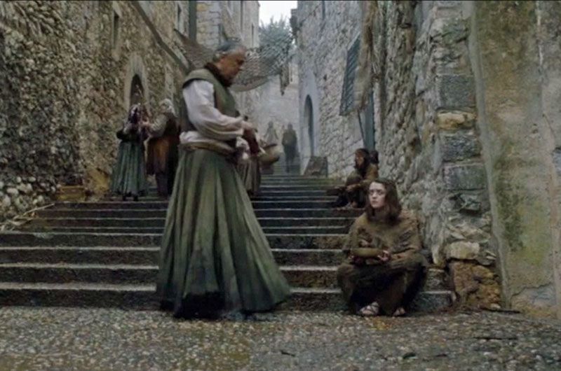 Arya Stark begging on the steps in Braavos