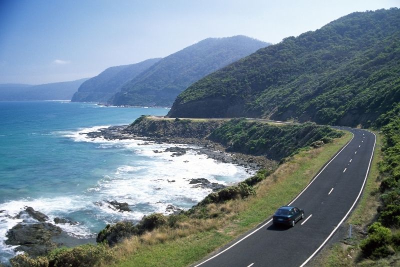 driving on a road next to the ocean